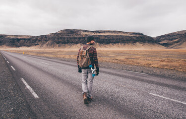 Skater traveling iceland on his longboard