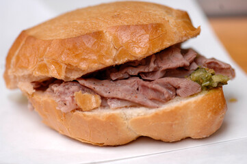 Lampredotto is the typical street food of the city of Florence in Tuscany and is a sandwich with a cow's stomach in a tomato sauce and put to stew