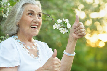 Fototapeta premium happy senior beautiful woman in spring park