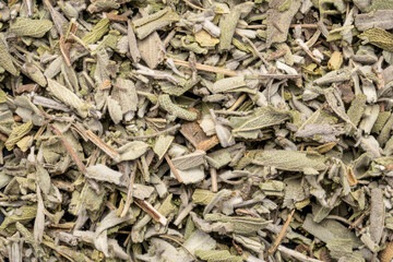 loose leaves of dry sage herb tea, top view of background and texture