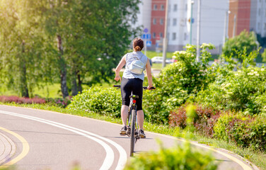 Cyclist ride on the bike path in the city Park
