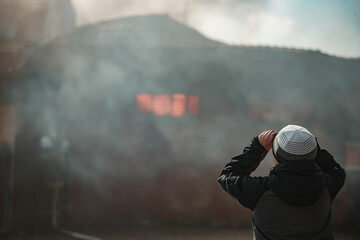 the fire destroys the building. the fire brigade pours water on the burning house. people are suffocating from the smoke and smog from the fire. fire victims