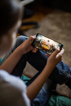 Illustrative editorial image of child playing Battlegrounds mobile