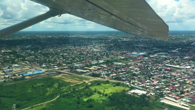 Aerial views from small airplane of Paramaribo&rsquo;s residential neighborhoods
