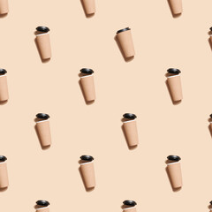 reusable eco coffee or tea cup pattern on beige background. Sustainable lifestyle.