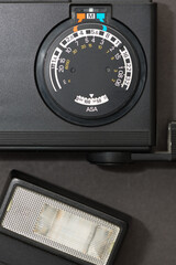 vintage electronic flash units, photographed from above with a macro lens, on grey background