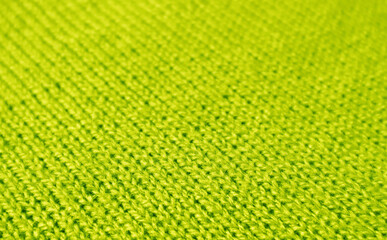 Closeup of Lime Green Alpaca Knitted Wool Fabric Texture in Diagonal Patterns for Background or Banner	