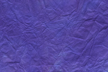 Fototapeta na wymiar 木目テクスチャー背景(青紫色) 揉み染めした鮮やかな青紫色の和紙