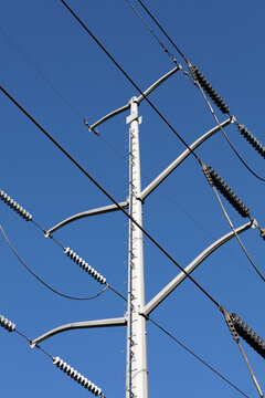 Electrical Power Lines tower against a blue sky