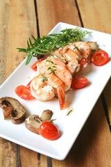 Rosemary thyme shrimps on plate