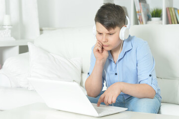 boy  using laptop at home