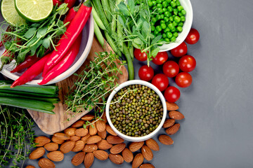Assorted vegetables and cereal on gray background. Healthy food concept.