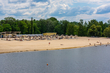 Beaches on the banks of the Khorol River in Myrgorod{Mirgorod} resort and a park area.