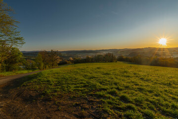 Obraz premium Meadows over Vizovice town with sunrise and fresh color air in east Moravia