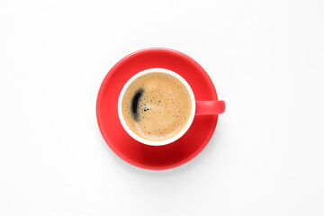 Aromatic coffee in red cup on white background, top view