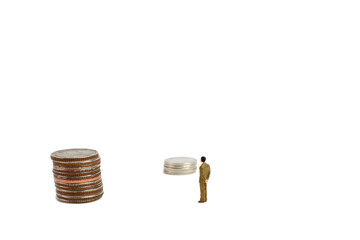 Miniature figures businessman on coins, on the white backgroud.