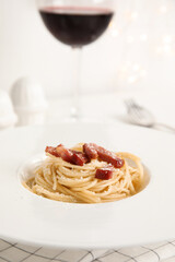 Delicious Carbonara pasta in plate on table