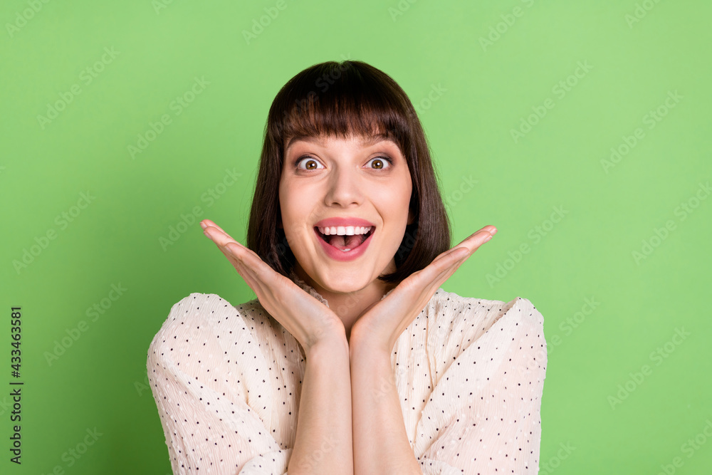 Canvas Prints Photo of young cheerful girl happy positive smile amazed shocked news isolated over green color background