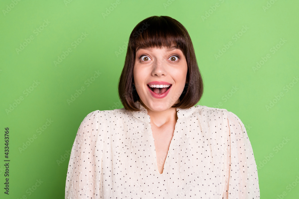 Canvas Prints Photo of young attractive girl happy positive smile amazed surprised news sale isolated over green color background