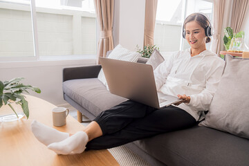 Asian Business Using Laptop Computer Online Working from Home