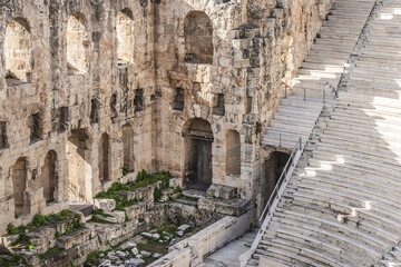 Fototapeta premium Top view of Greek ruins of Odeon of Herodes Atticus (161AD) - stone Roman theater at the Acropolis hill. Athens, Greece.