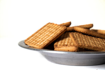 cashew cookies on white indian biscuits wheat biscuits in the steel plate white background