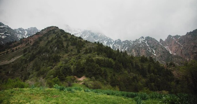 Big Chimgan in clouds. Mountains Chatkal Uzbekistan. Central Asia 1 of 4