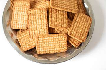 cashew cookies on white indian biscuits wheat biscuits in the steel plate white background