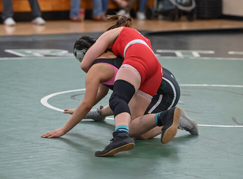 Female High School Wrestlers Competing At A Wrestling Meet