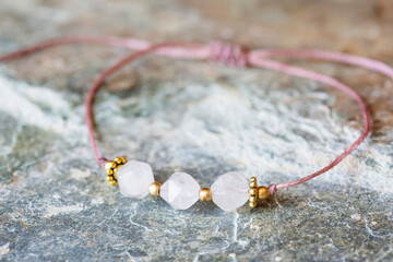 Rose quartz cubic cut mineral stone bead bracelet on natural background