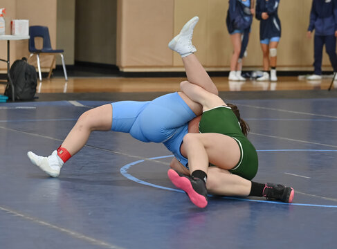 Female High School Wrestlers Competing At A Wrestling Meet