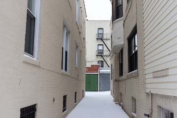 White Snow Covered Residential Alley in Astoria Queens New York during Winter
