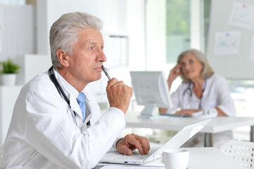 male  doctor working  at desk