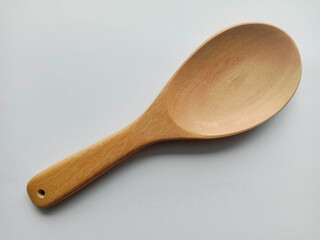 wooden spoon kitchenware isolated on white background closeup.