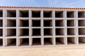 Empty grave sites with numbers in the cemetery. Canary Islands