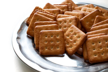 cashew cookies on white indian biscuits wheat biscuits in the plate white background