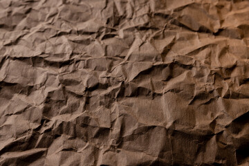 crumpled paper.sheet of brown cardboard paper. detailed high resolution texture. abstract background for wallpaper.