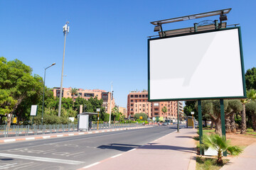 Empty mockup of blank white billboard on street in Marrakesh, Morocco. Outdoor billboard or...