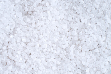 Sea salt close-up on a white background.