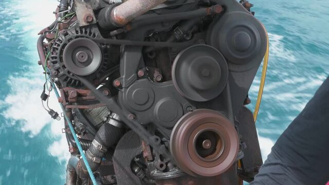 Engine boat running with sea wave in background. Close up shot of working engine. 4K
