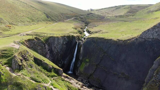 Aerial of Spekes Mill Mouth Waterfall, in Devon on the UK coast