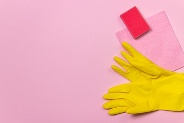 Cleaning products on a colored background. Indoor cleaning tools. Cleaning tools on pink background