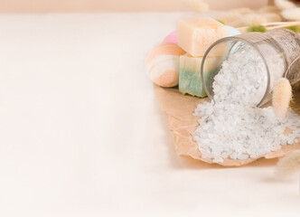 A set of products for taking a bath. Salt, soap, bath bombs on a white background. Copy space....