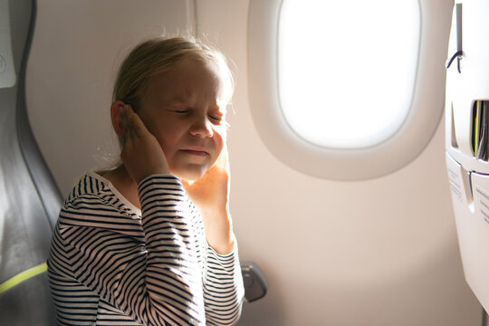 A 7-year-old Girl Is Flying In An Airplane And Has Pain In Her Ears.