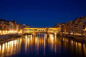 Fototapeta na wymiar Ponte Vecchio over Arno river in Florence, Italy at blue hour after sunset.