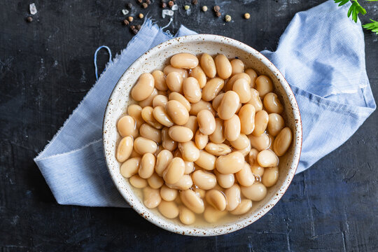 white beans cooked ready to eat beans boiled legumes on the table healthy food meal snack copy space food background rustic. top view keto or paleo diet
