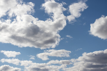 blue sky with ragged clouds in good weather
