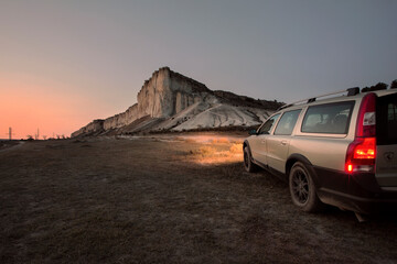 Fototapeta na wymiar White rock in the Crimea at sunset in the headlights