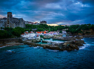 Fototapeta premium Fishing harbour at Biarritz, France, on a stormy night