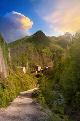 path leading to the small medieval town of Isola Santa in Garfagnana during sunset